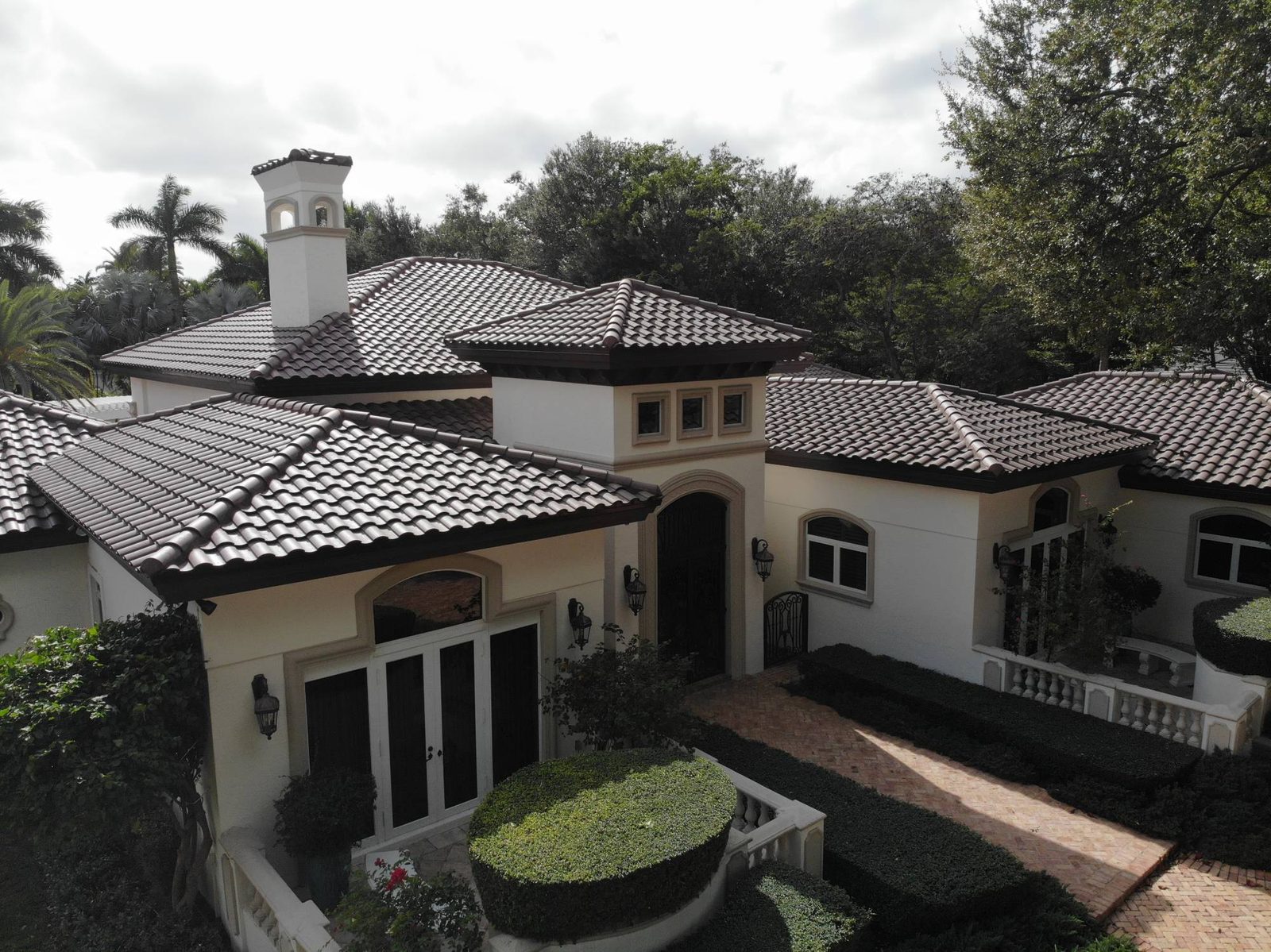 High-profile clay-look tile roof on a Mediterranean-style South Florida home