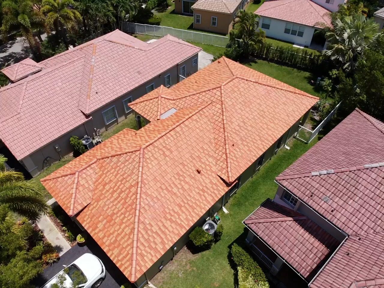New two-tone terracotta concrete tile roof on a single-story South Florida home